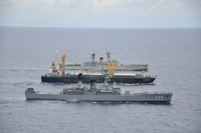 MV_Sinar_Kudus_escorted_by_two_Indonesian_Navy_frigates.png